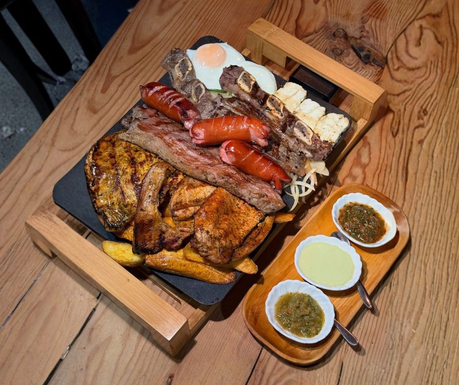 Selection of popular dishes at Guido's Grill including steak, ribs, chorizo, halloumi and wedges